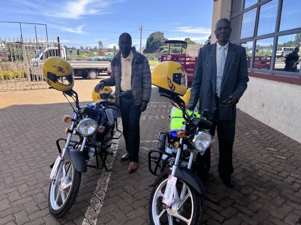 2 national church planters in Kenya receiving a motorbike for thier ministry