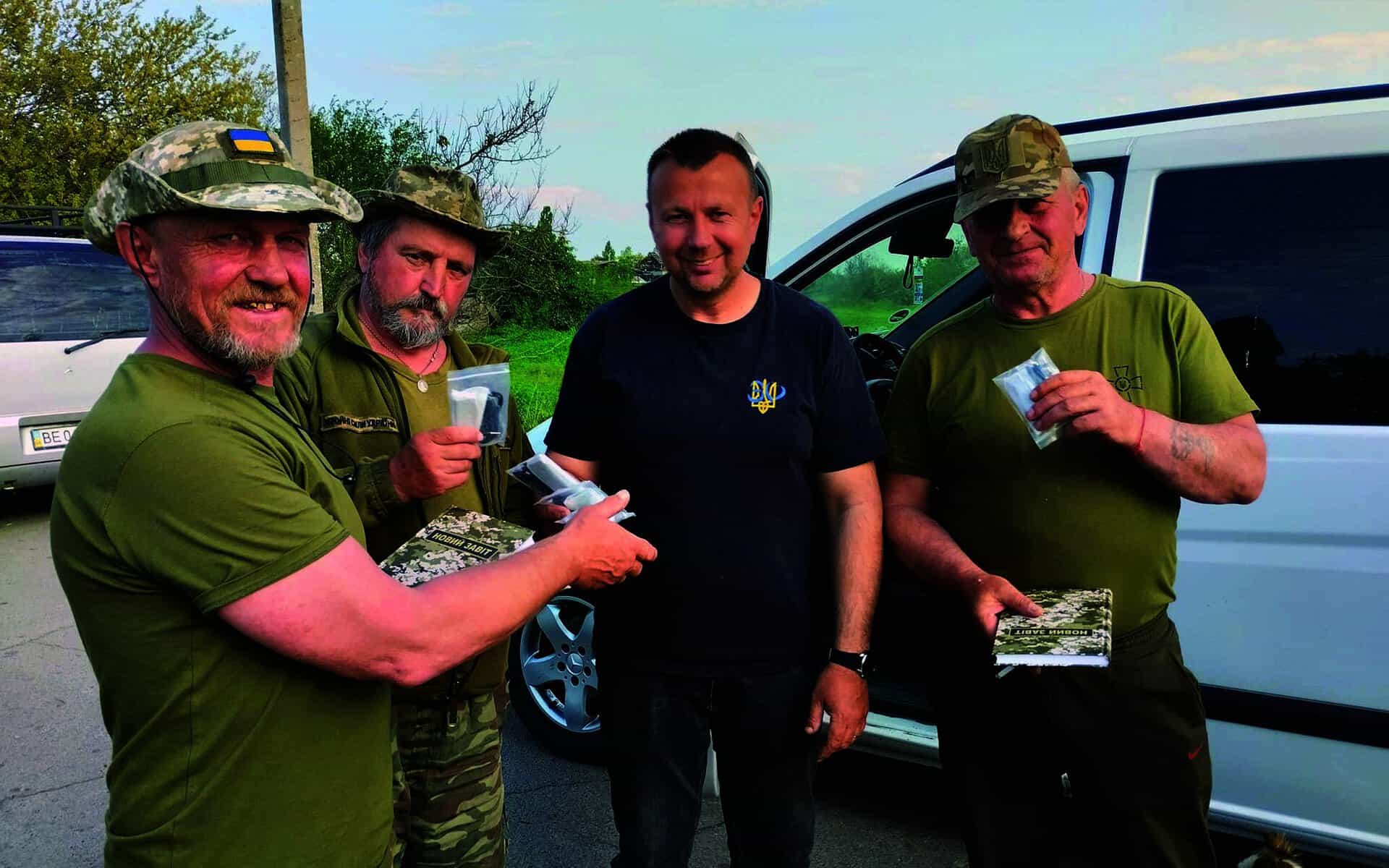 Oleg delivers Bibles for service men.