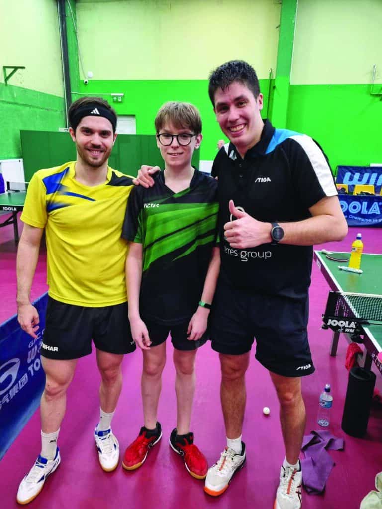 Simon Enskyy (middle) with Hungarian table tennis players in Budapest.