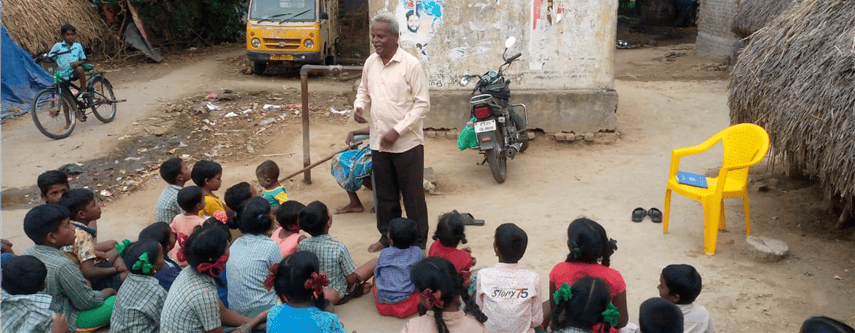 National church planter leading a Bible lesson in a rural village.