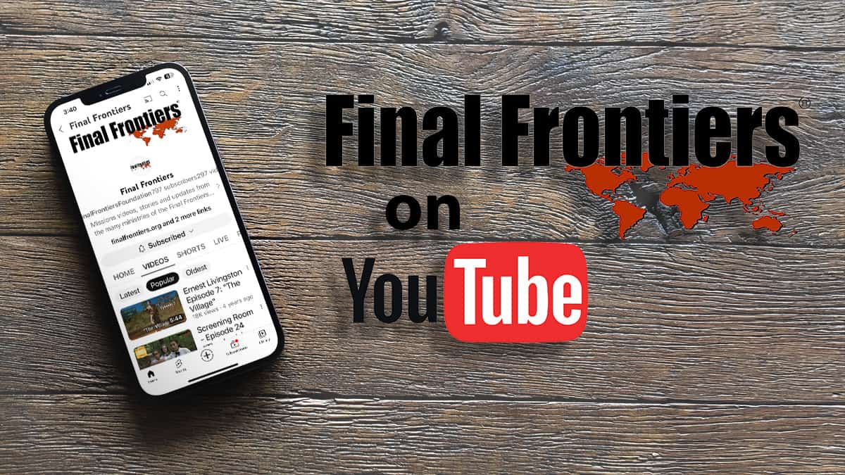 A smartphone displaying the 'Final Frontiers' YouTube channel rests on a wooden surface. Beside it are bold texts that read 'Final Frontiers on YouTube' with a stylized map of the world in the background, highlighting various regions in red, and the YouTube logo at the bottom.