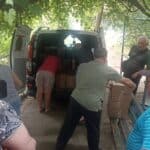 Volunteers unload supplies for the Odesa feeding ministry.