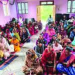 Outcast women in India and their children at a Wednesday worship service in their church