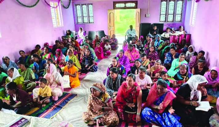 Outcast women in India and their children at a Wednesday worship service in their church