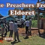 Church members gather around a new clean water well and tank at a church in Eldoret, Kenya